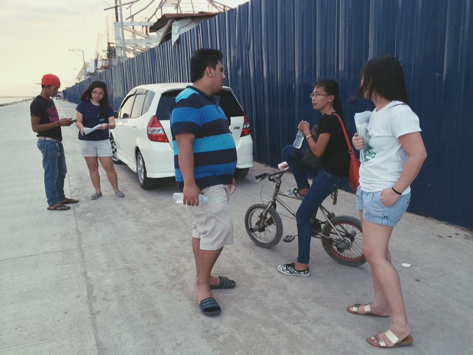Ashley Uy and the Symph team conducting user interviews outside a construction site in Cebu City, Philippines